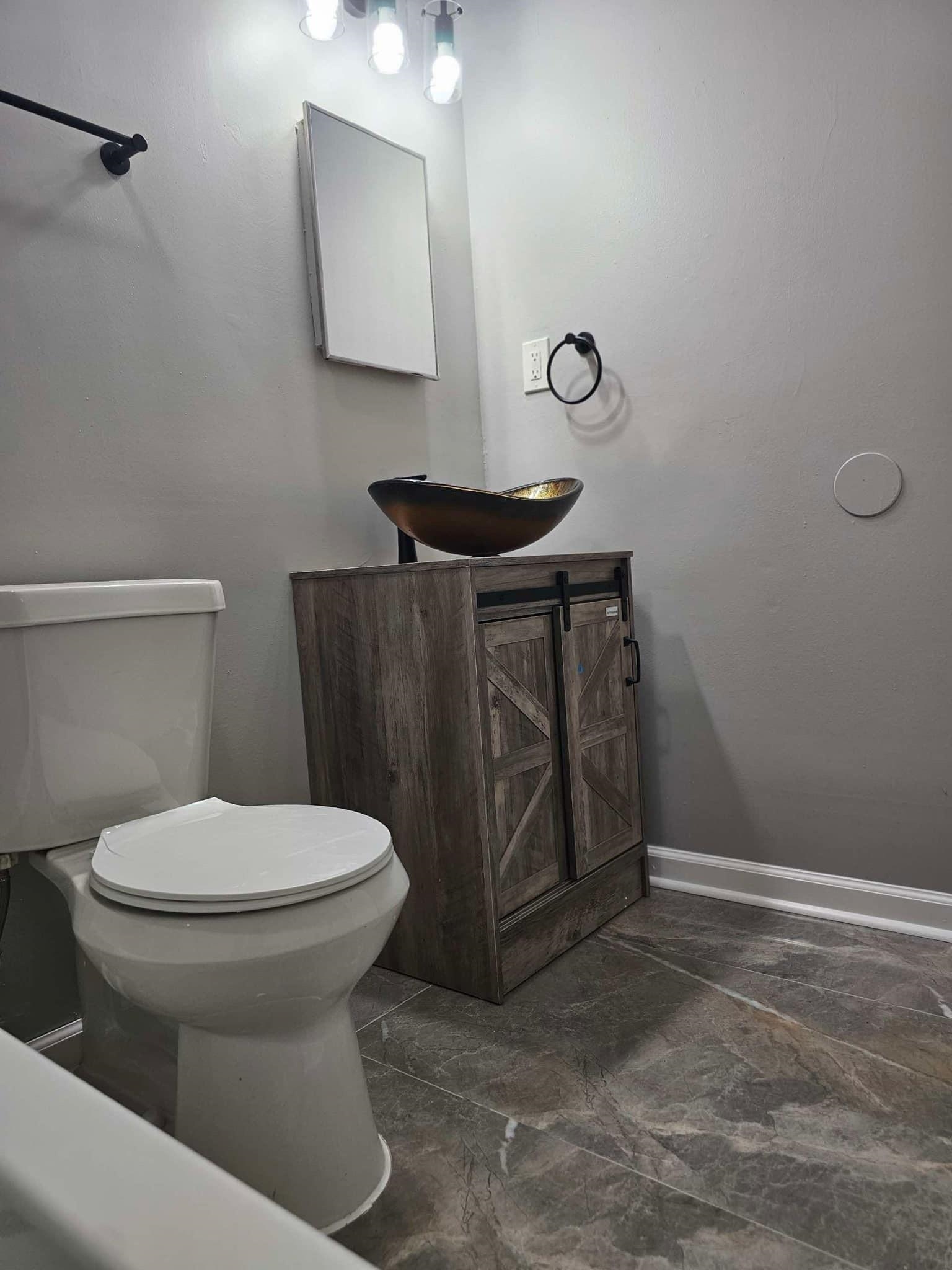 a bathroom with a sink and a toilet