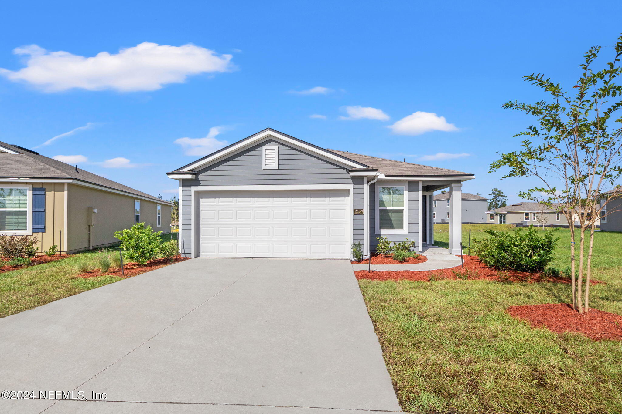 front view of a house with a yard