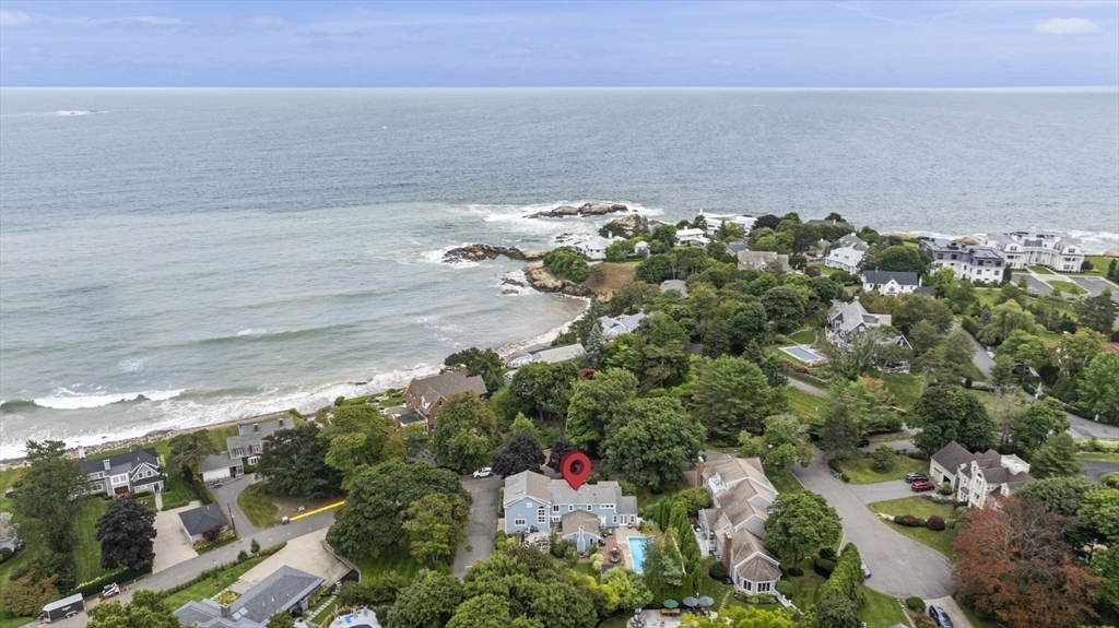 an aerial view of a houses with a yard