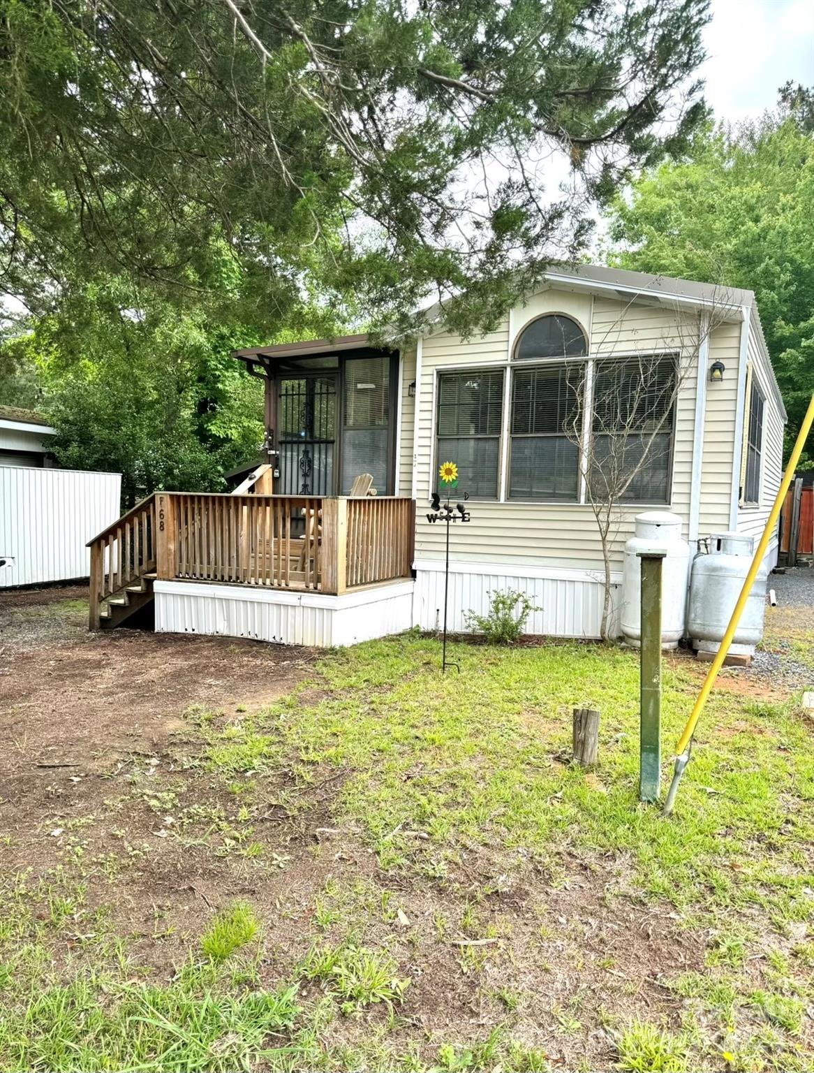 a view of a house with pool and a yard