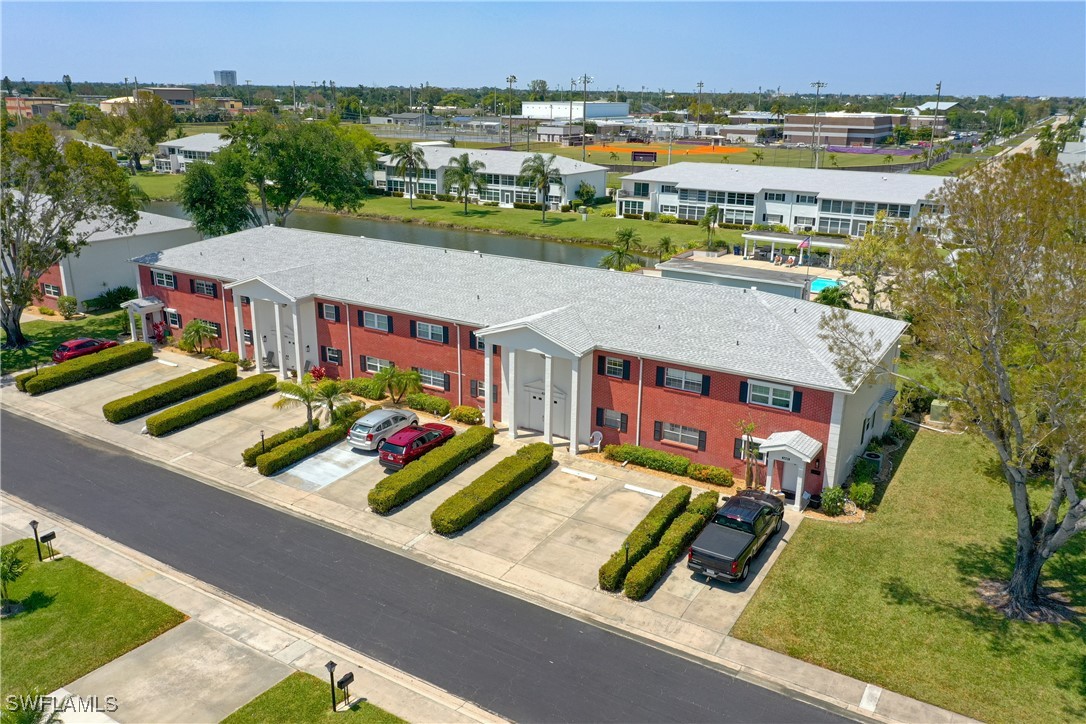 an aerial view of residential houses with outdoor space and street view