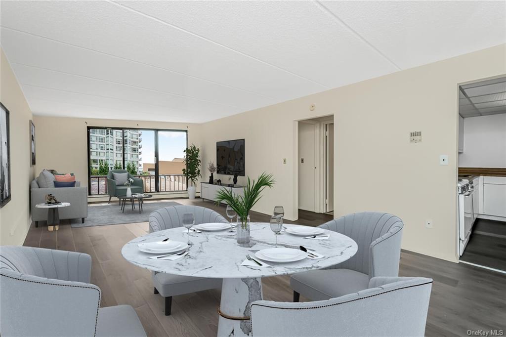 a view of a dining room with furniture and wooden floor