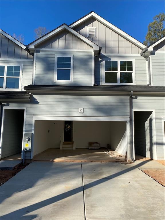 a front view of a house with a garage