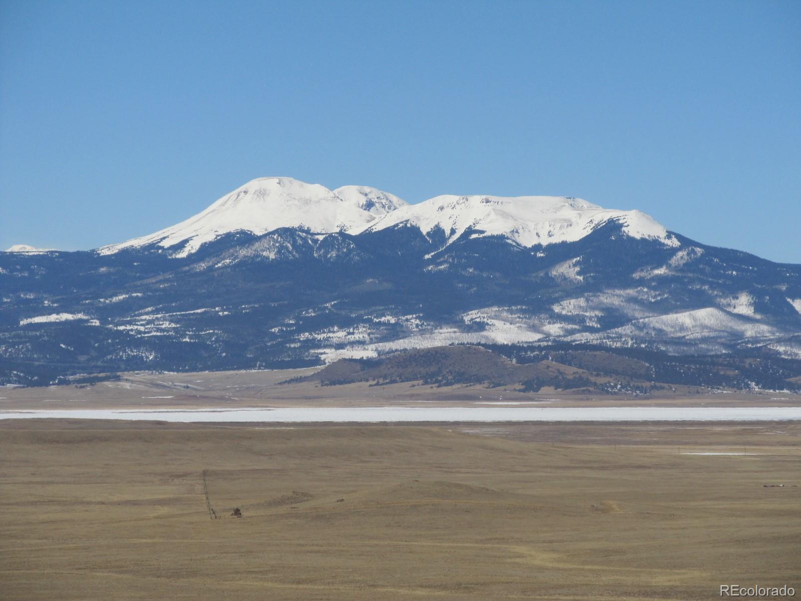 a view of a lake with mountains in the background