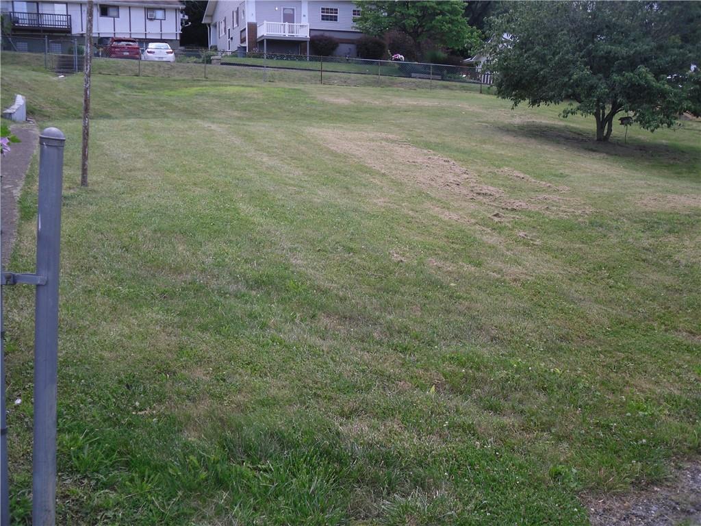 a view of a yard with table and chairs