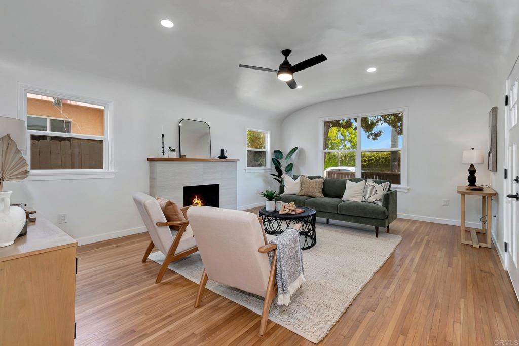 a living room with furniture and a fireplace