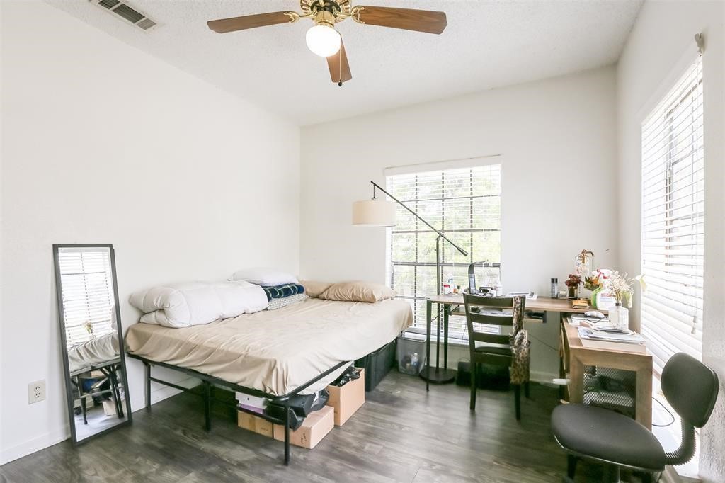 a living room with furniture a window and a table