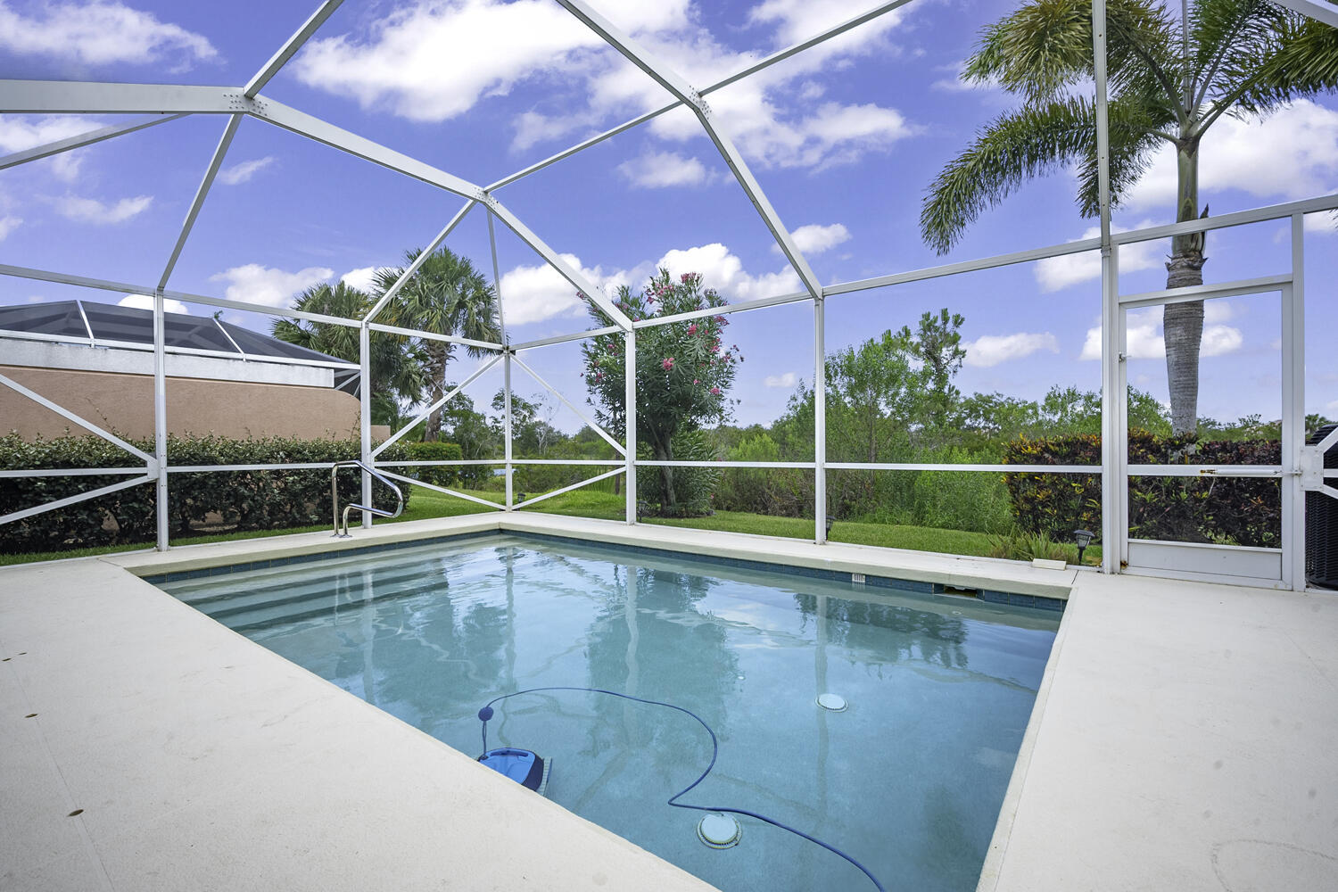 a view of a backyard with swimming pool