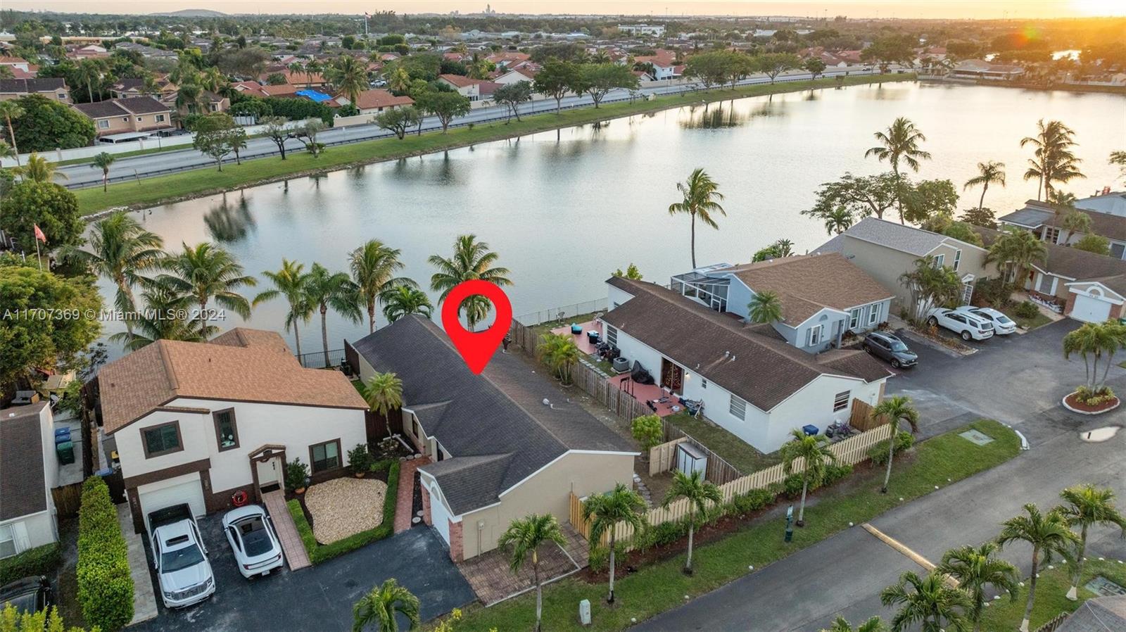 an aerial view of residential building and lake