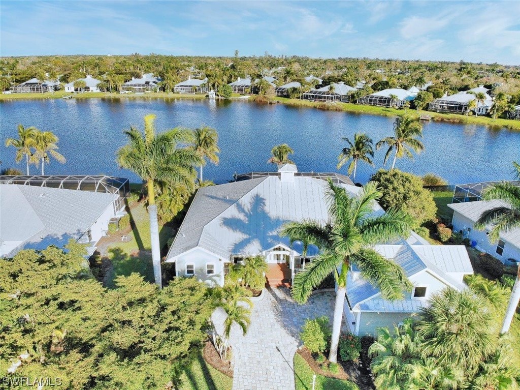 an aerial view of a houses with a lake view