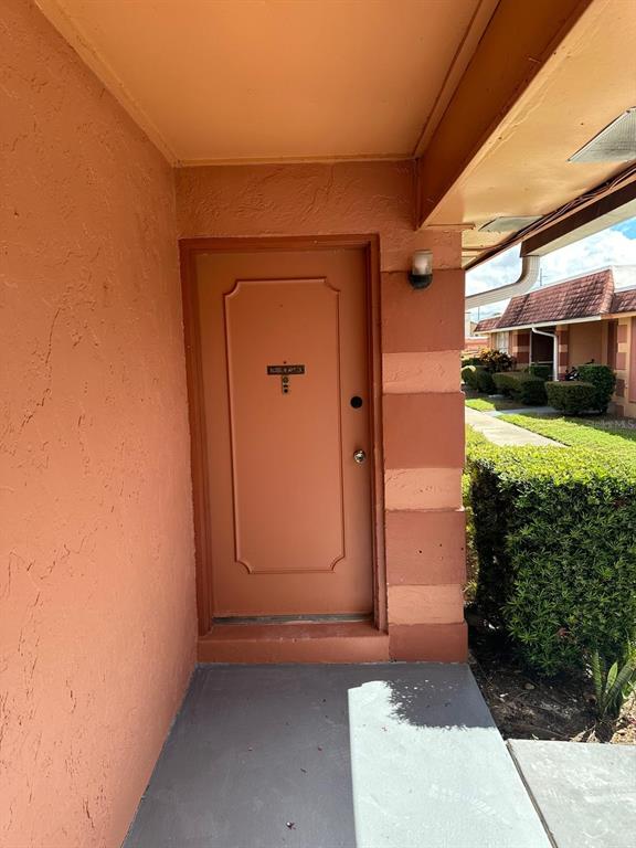 a view of a door and a window