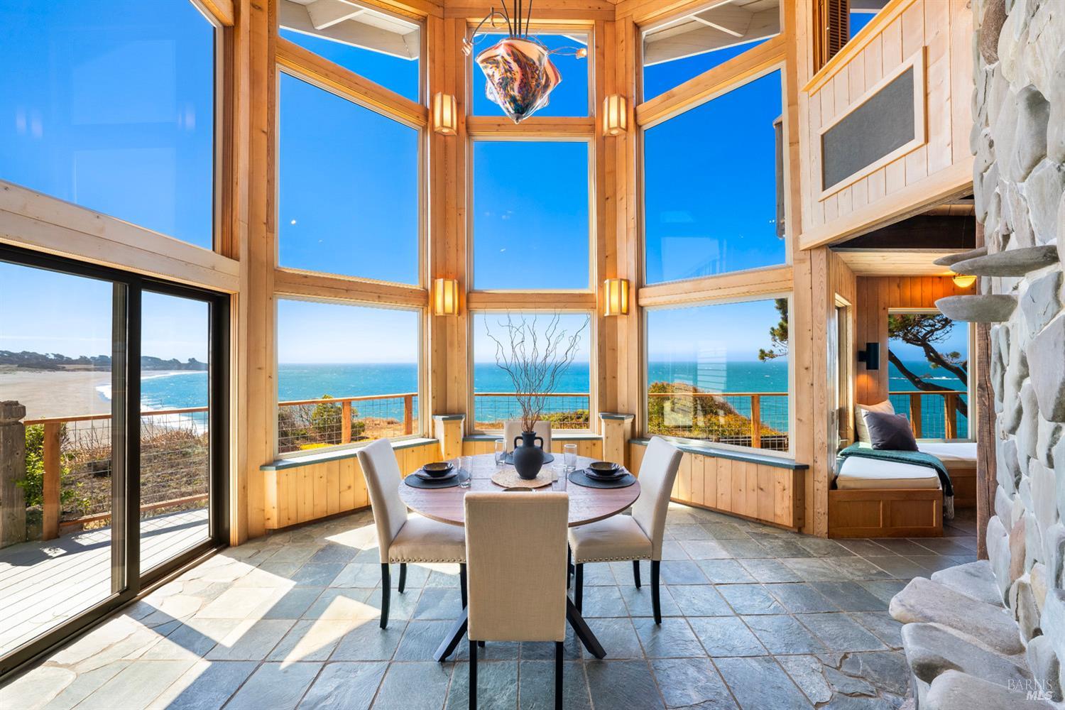 a dining room with a table and chairs