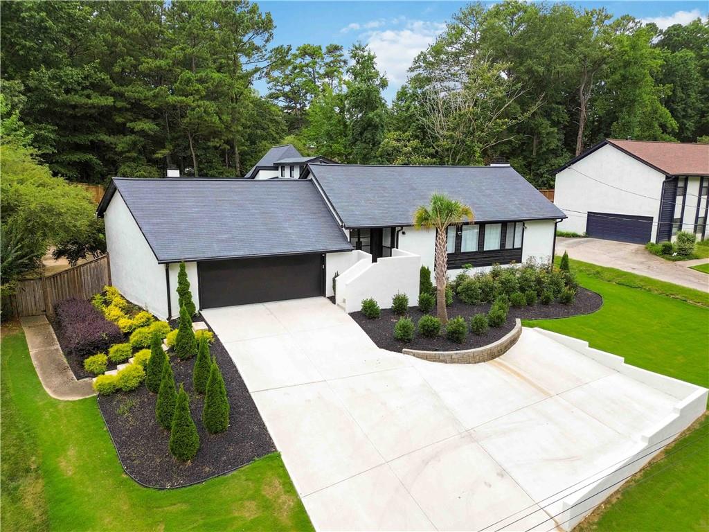 a aerial view of a house with swimming pool and patio