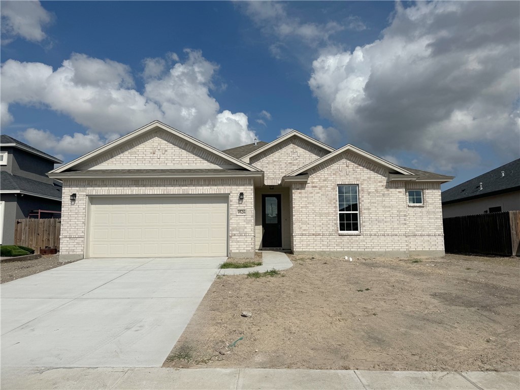 a view of house with garage