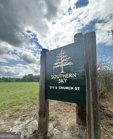 a sign on the side of the road