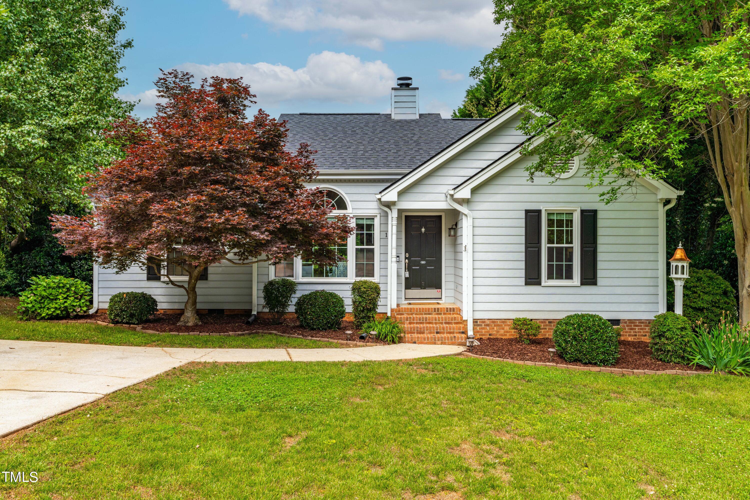 a view of a house with a yard porch and sitting area