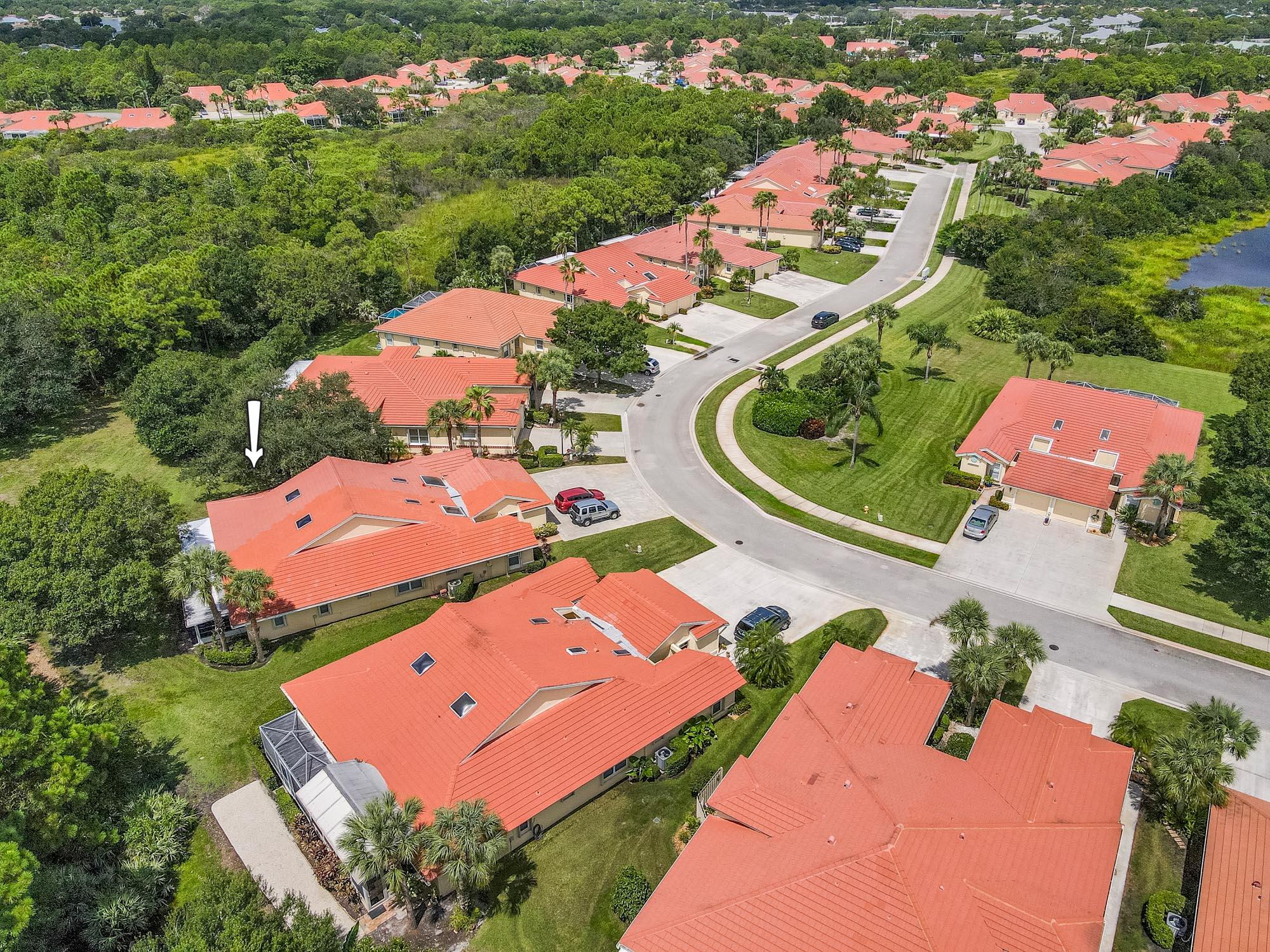 an aerial view of a house with a garden