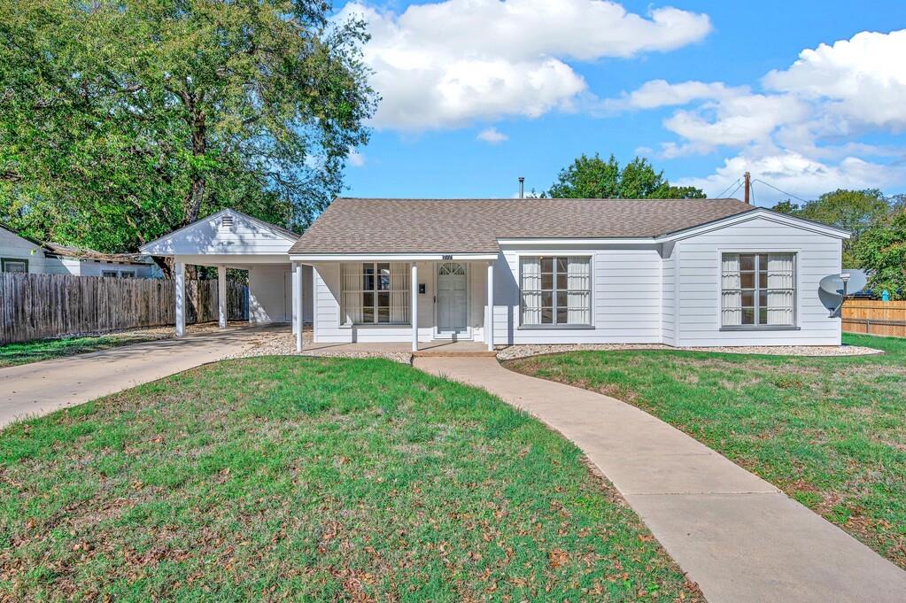 front view of a house with a yard