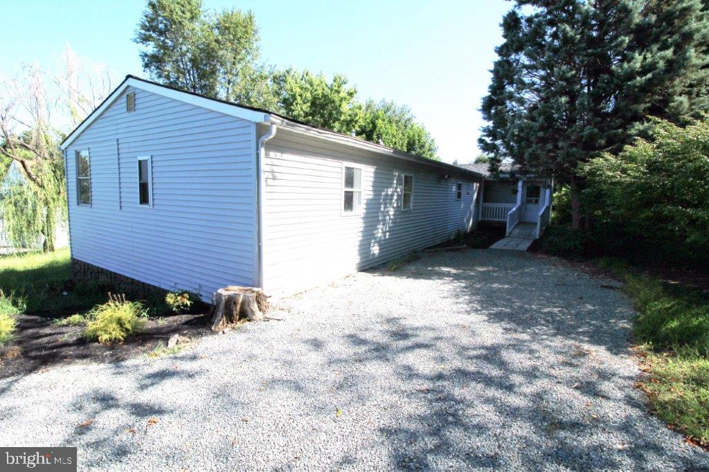 a backyard of a house with a yard and garage