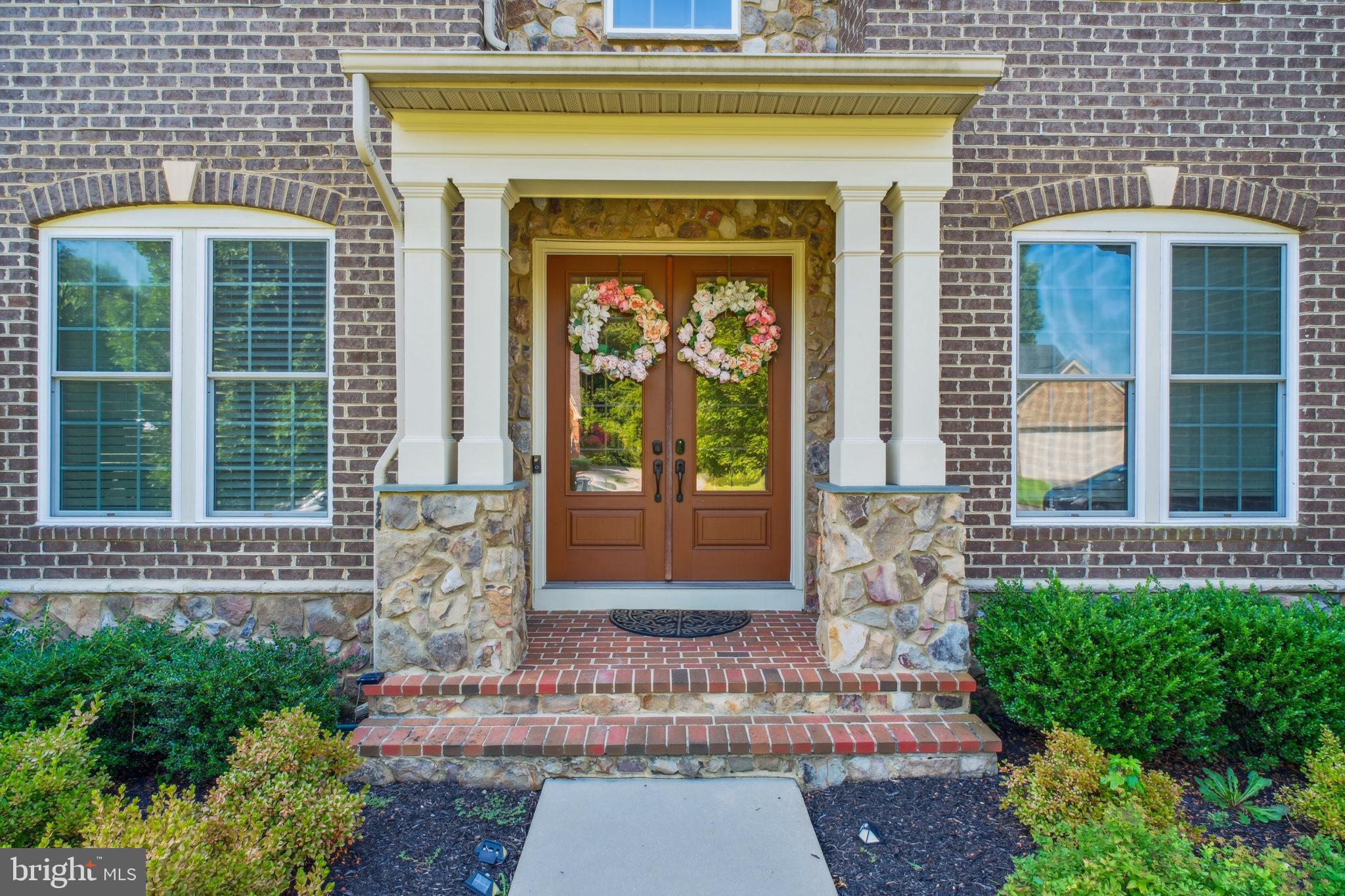 a front view of a house with a porch