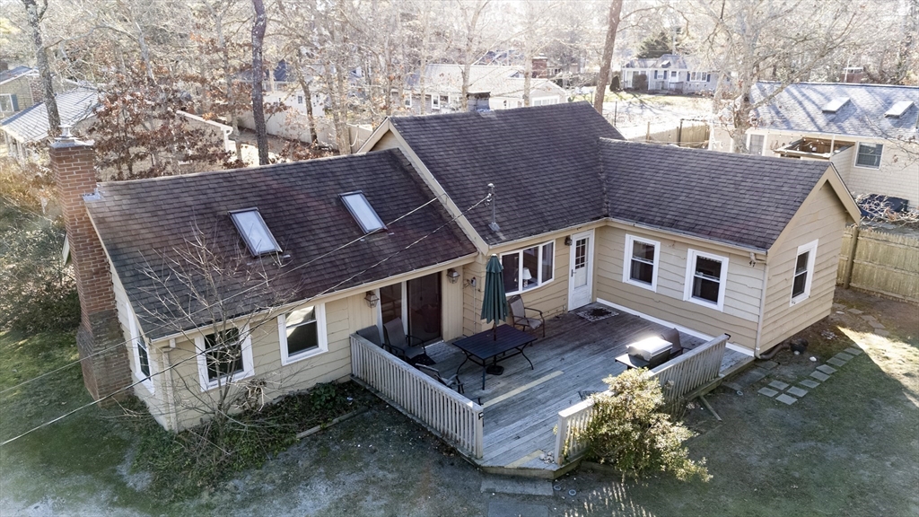 a aerial view of a house with a yard