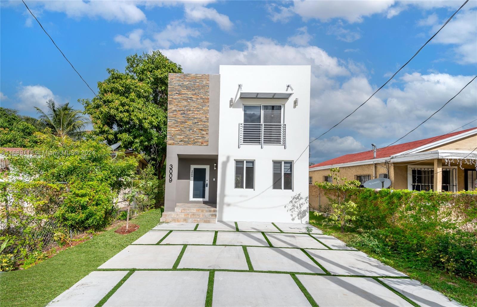 a view of a brick house with a yard