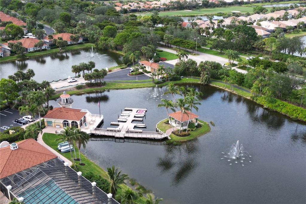 an aerial view of a house with outdoor space and lake view