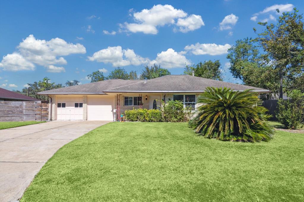 a view of house with yard and entertaining space