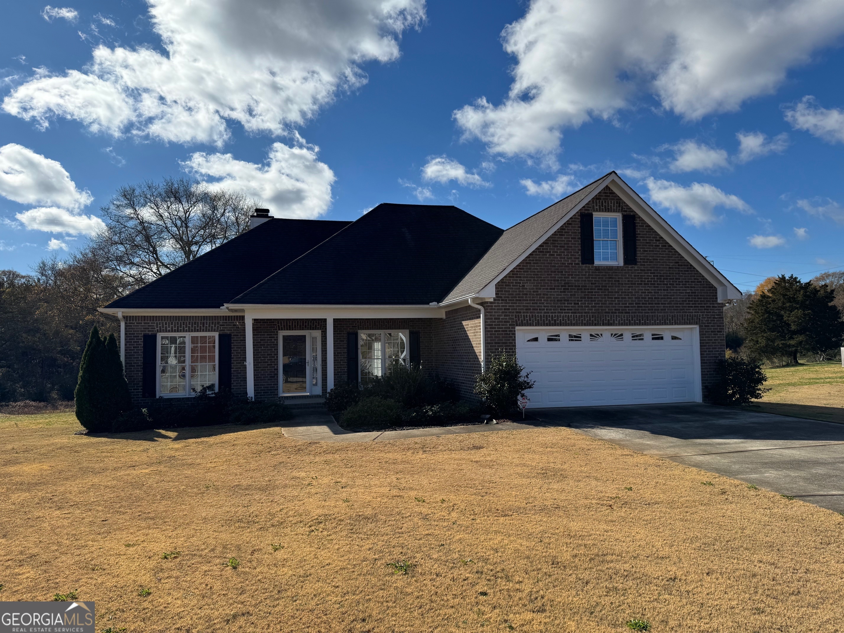 a front view of a house with a yard