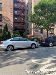 a car parked in front of a brick building