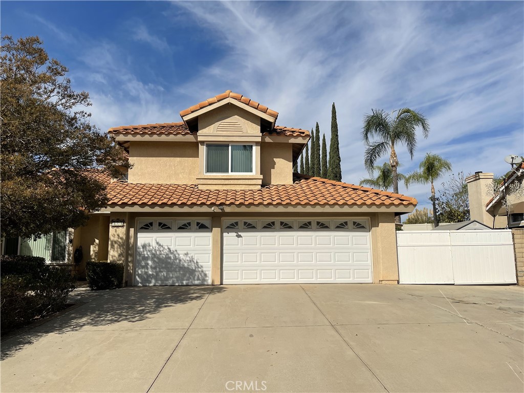 a front view of a house with a garage