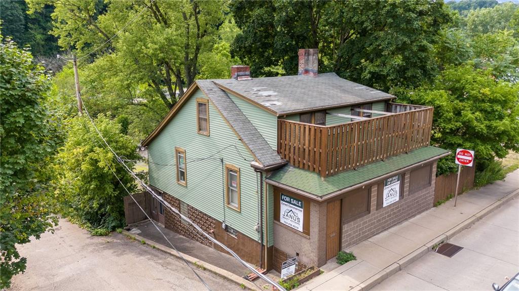 a view of a house with a sink and backyard