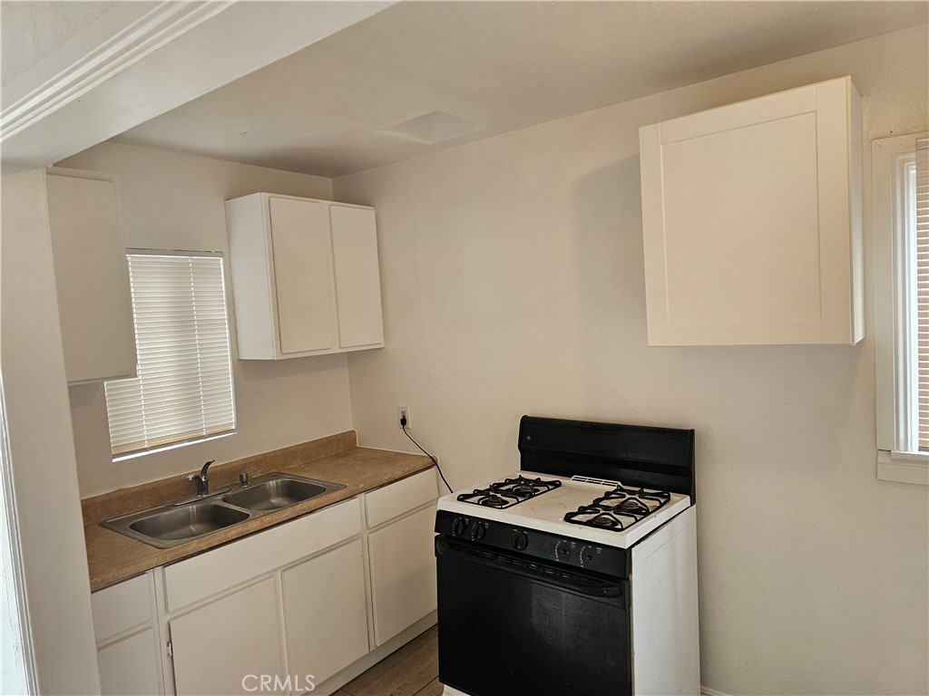 a kitchen with a stove and a sink