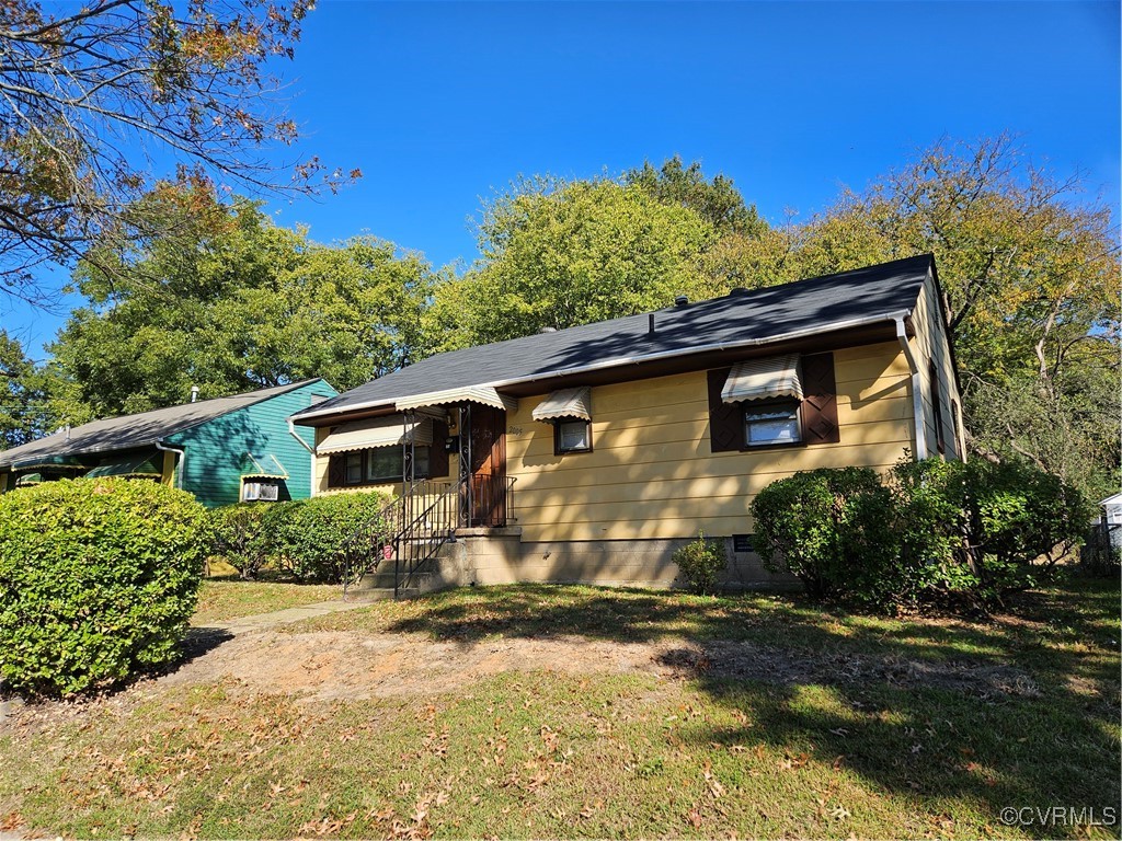 a front view of a house with a yard