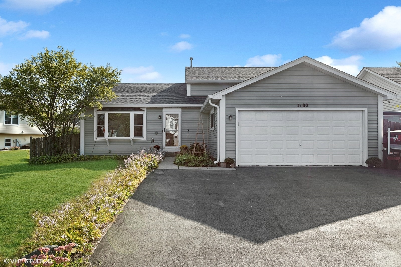 a view of a house with a yard