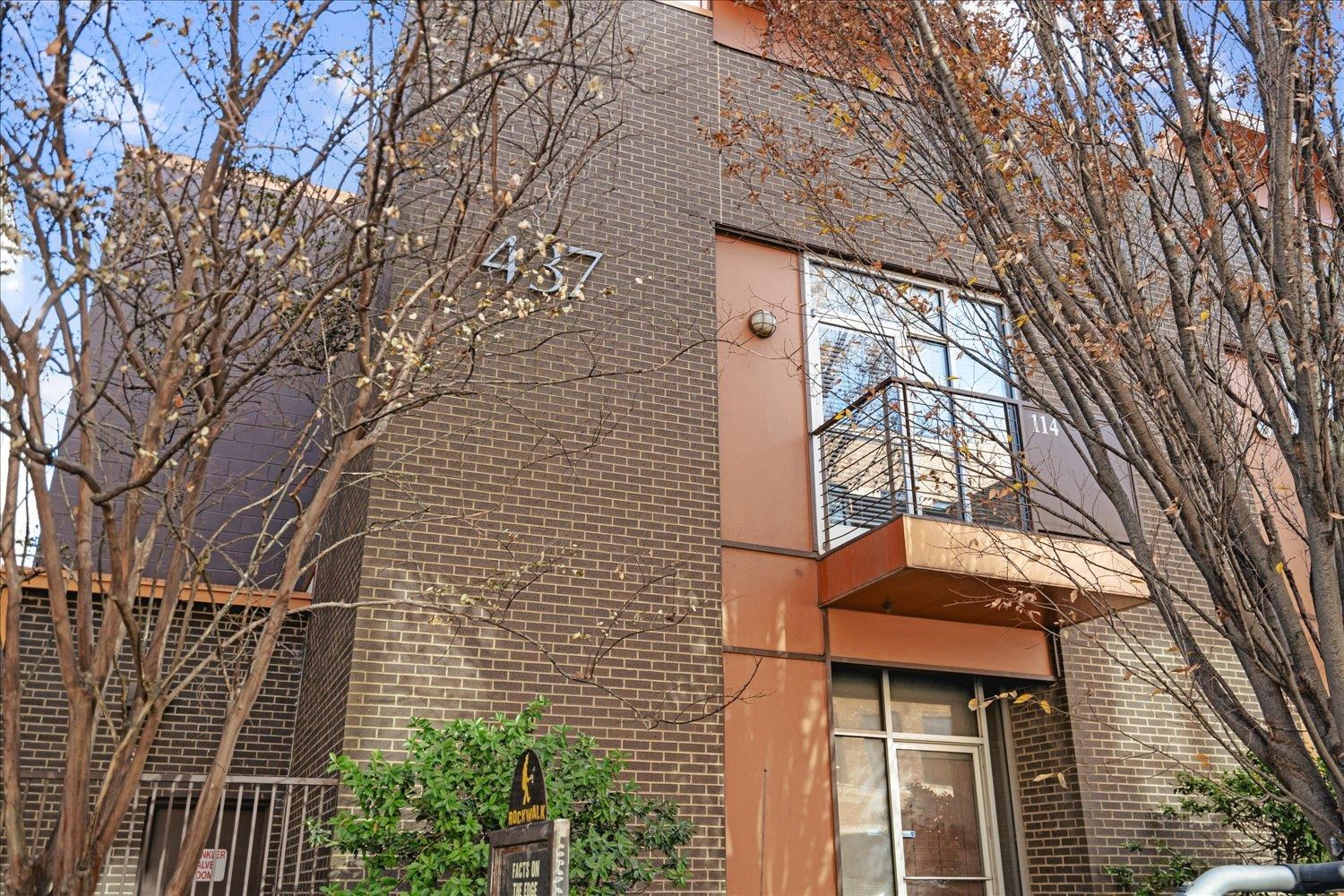 a building with trees in front of it