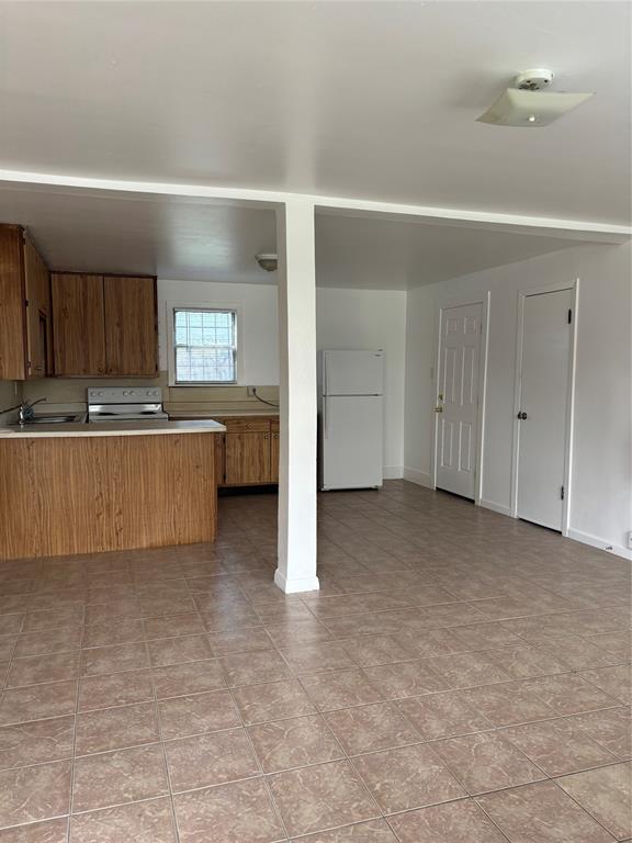 a view of a kitchen with a sink