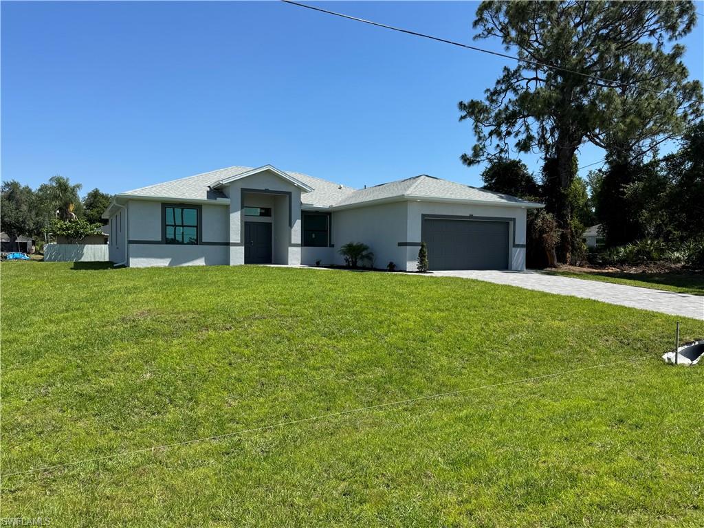 a front view of a house with a yard