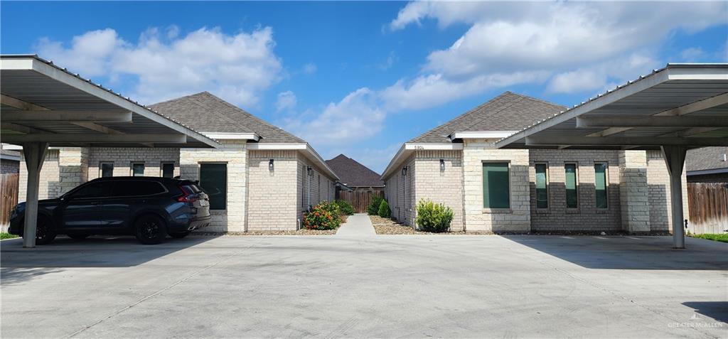 a view of a car park in front of house