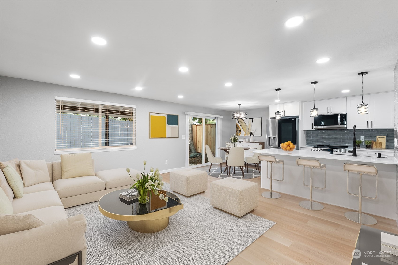 a living room with furniture kitchen and a kitchen view