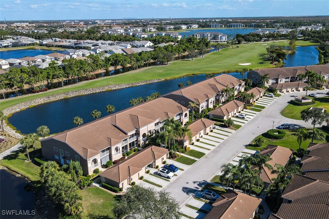 an aerial view of a house with a lake view