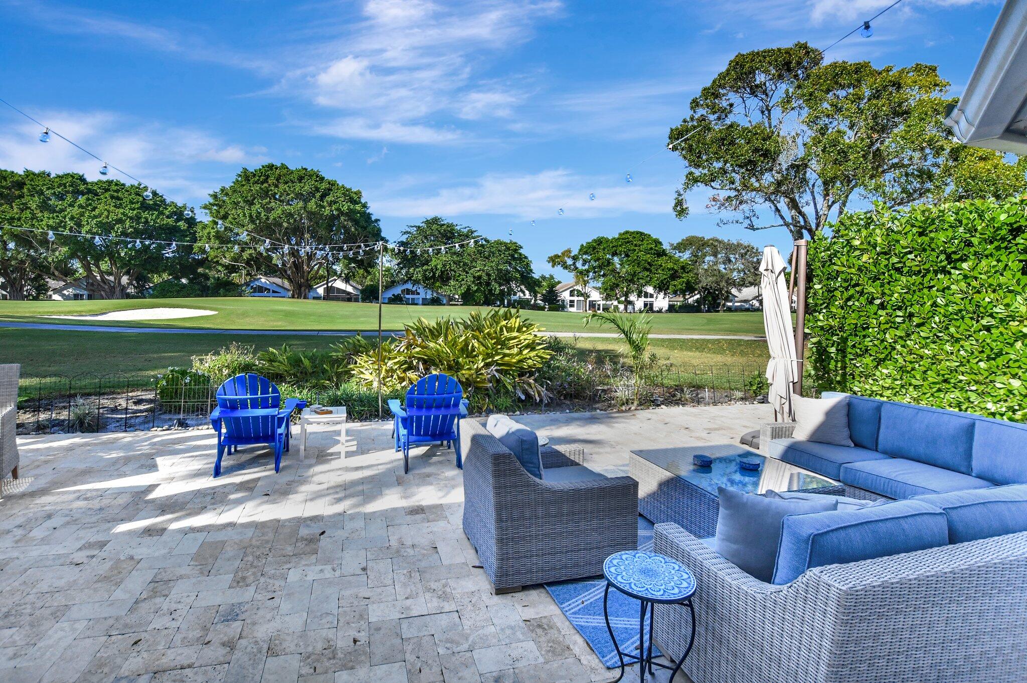 a park view with a seating space and hardwood floor