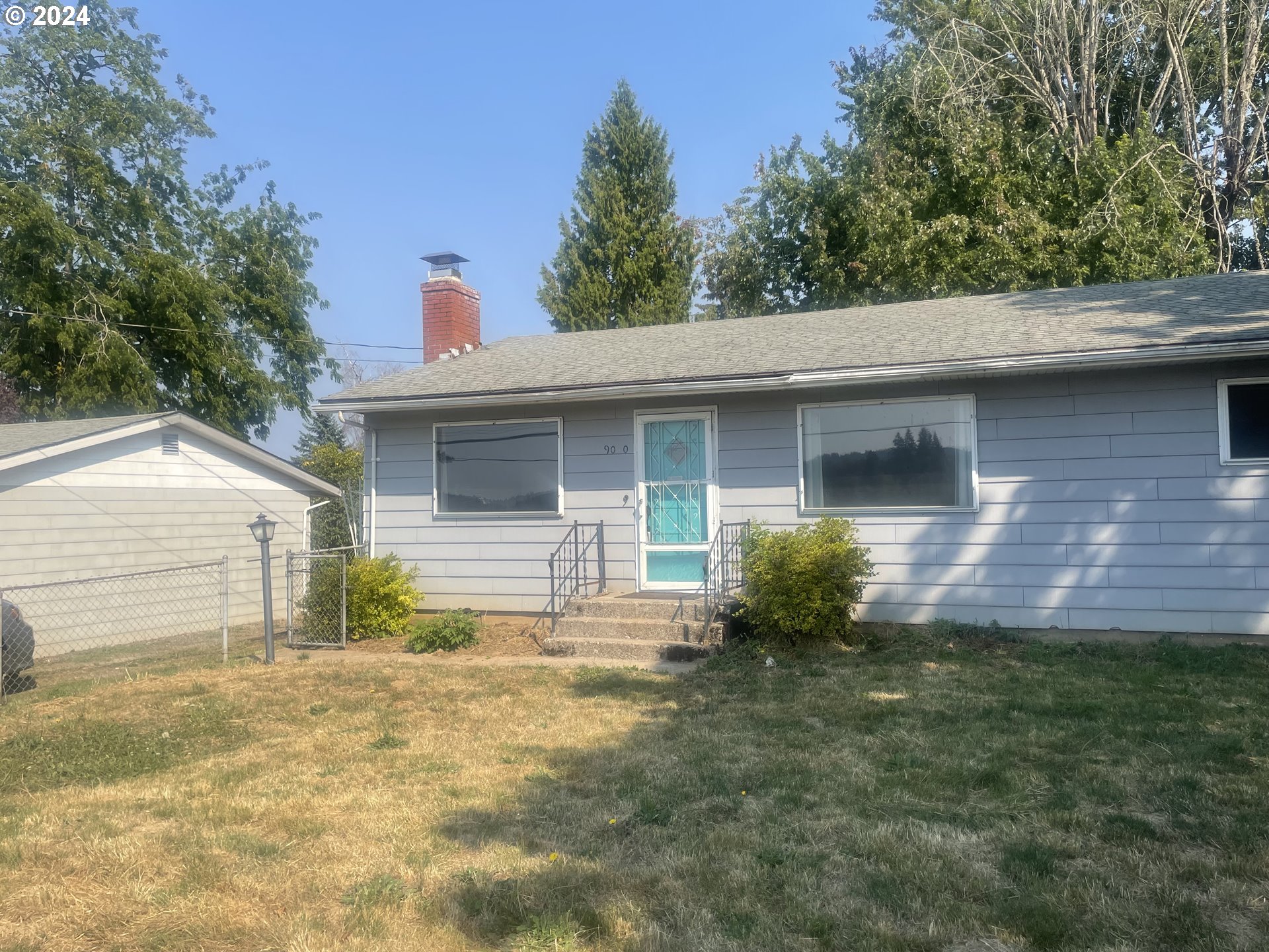 a front view of a house with yard