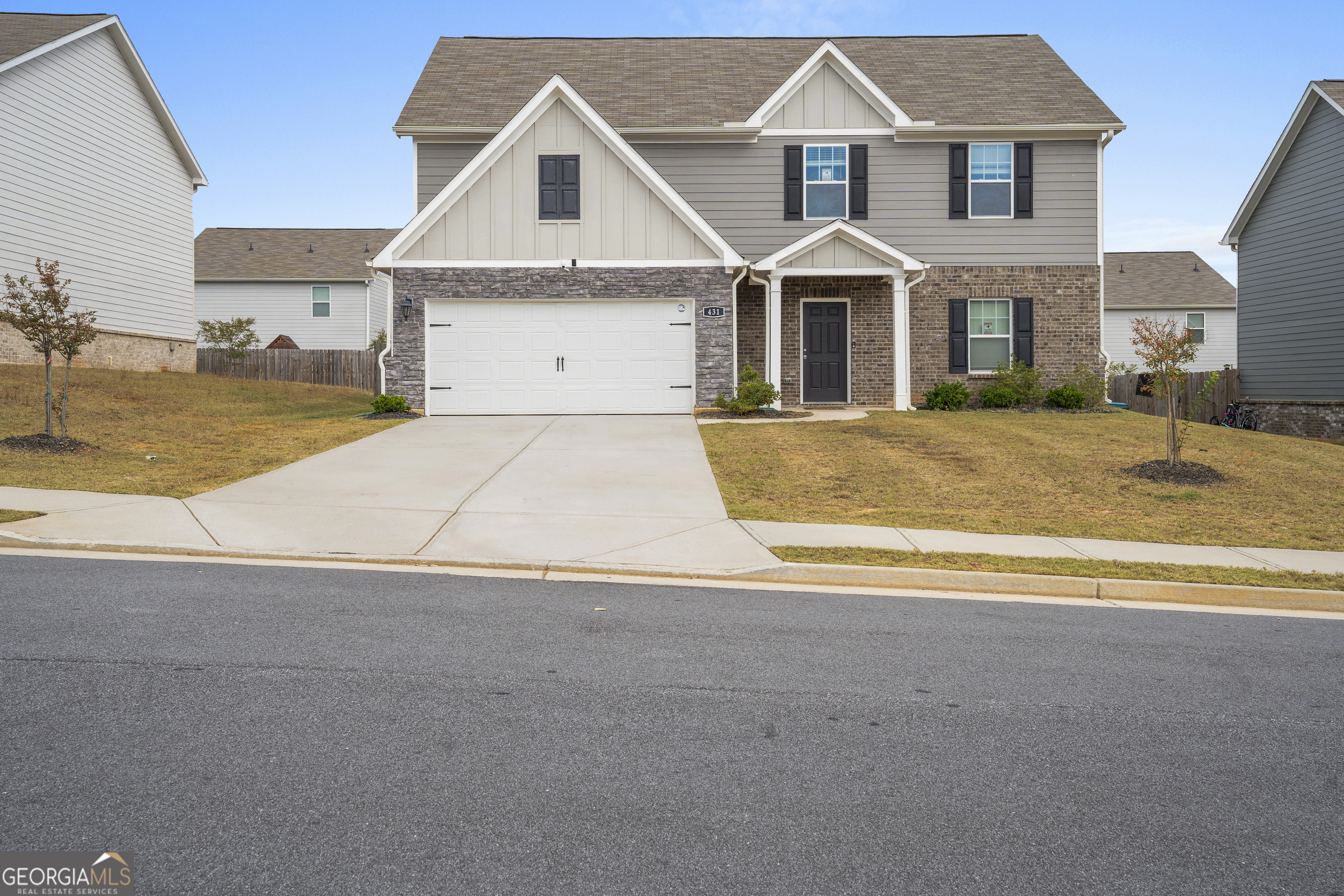 front view of a house with a yard