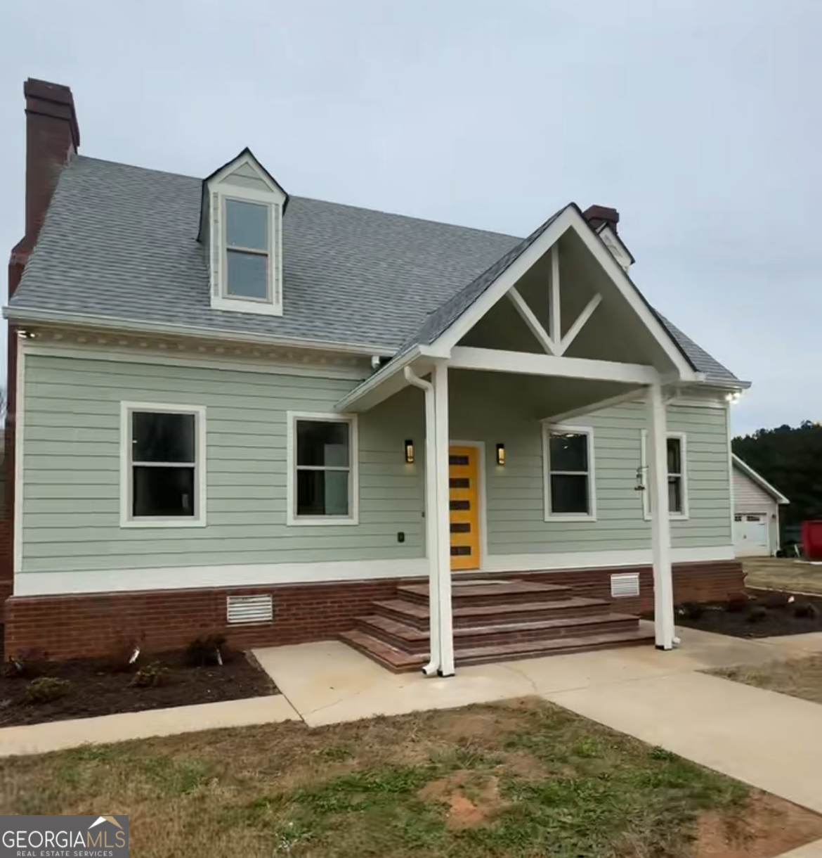 a front view of a house with a garage