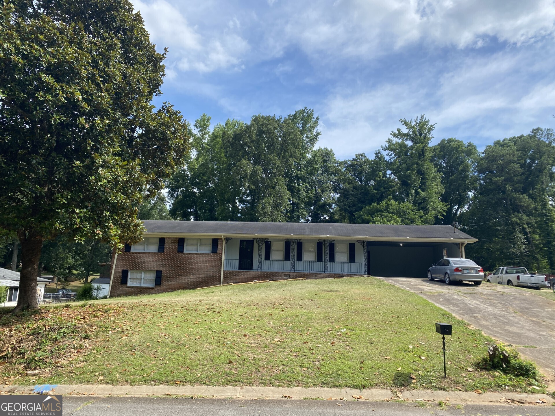 front view of a house with a yard