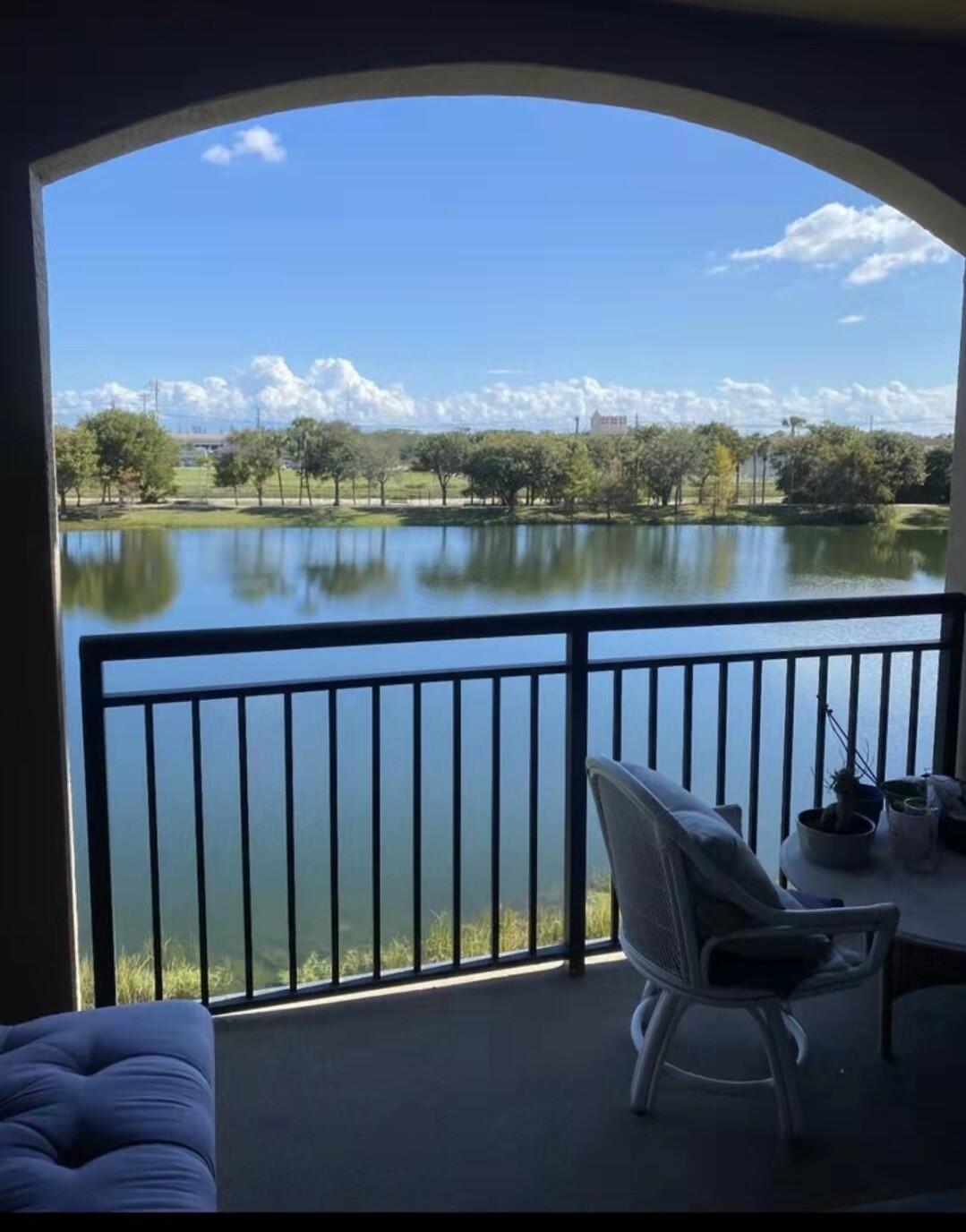 a view of a balcony with lake view and mountain view