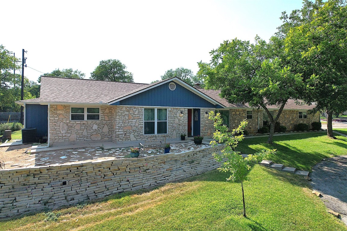 a front view of house with yard and green space