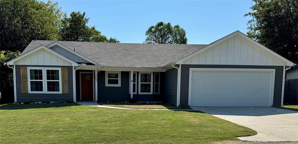 front view of a house with a yard