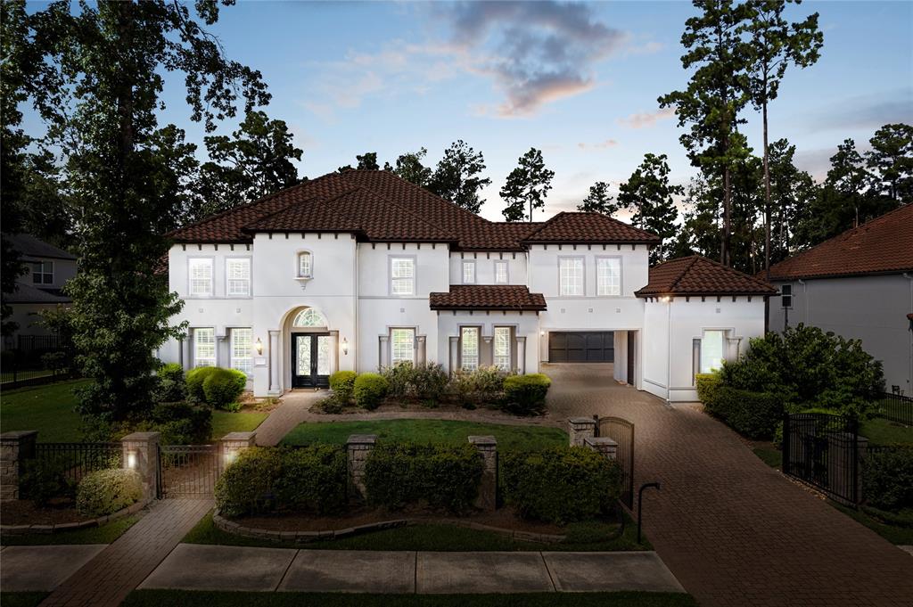 a view of house with garden space and street view